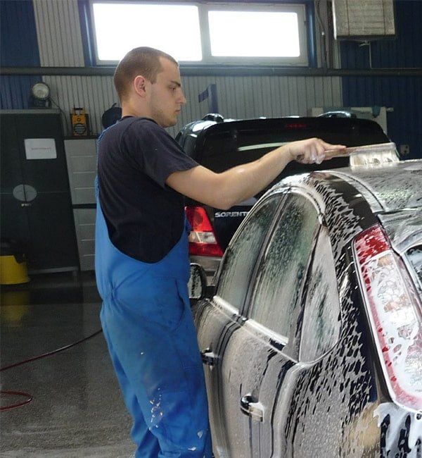 City Car Wash team member detailing a car interior